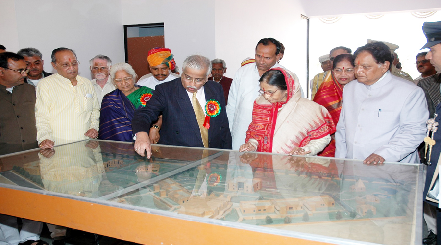 Mr. C.S. Jain describing the map of college model to Her Excellency Mrs. Pratibha Patil,  Governor Rajasthan